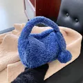 Chic blue plush handbag with fluffy faux fur and round handle for winter fashion - Blue