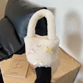 Creamy white plush faux lamb wool bucket bag featuring colorful bows and lace patch - Off White