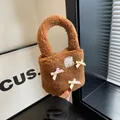 Brown faux lamb wool bucket bag with colorful bows and lace patch detail - Brown