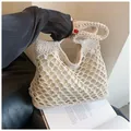 Detail of beige crochet beach tote featuring diamond mesh pattern and fabric lining - Beige