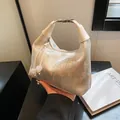 Champagne silk hobo bag with floral bird embroidery and white bead drawstring - Off White