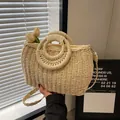 Beige woven straw bag with ring handles and shoulder strap for summer beach style - Off White