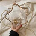 Borsa a mano a stella in acrilico trasparente con cornice dorata e tracolla di perle - Trasparente
