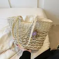 Straw tote bag in cream and natural brown weave featuring a purple 3D flower charm - Beige