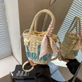 Straw bucket bag with hello embroidery and floral scarf detail for summer - Blue