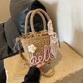 Handwoven straw tote bag with pink Hello embroidery and floral scarf in light brown - Pink