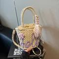 Beige woven straw bucket bag with purple hello embroidery and floral scarf detail - Purple