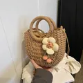 Handmade straw handbag with beige flower charm and drawstring liner in natural tan - Matte Khaki Sunflower