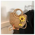 Handwoven straw bag featuring a yellow sunflower and a drawstring lining for beach vacations - Sunflower Khaki