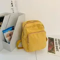 Mini rugzak van gewassen canvas in helder geel met meerdere ritscompartimenten - Geel