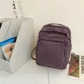 Mochila vintage de lona violeta minimalista con bolsillo frontal y estilo retro - Púrpura