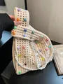 Beige knit handbag featuring iridescent colorful pearls and a pearl shoulder strap - Off White
