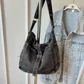 Dark grey washed denim tote bag with vintage frayed edges and buckle strap detail - Black