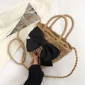 Straw bucket bag with black silk bow, featuring dual handles and woven shoulder strap - Large Black Bow Style / Khaki