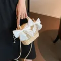 Beige woven straw bucket bag with large white satin bows and dual carry straps - Dual White Bow Style / Off White