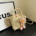 Beige straw bucket bag with knitted pink flower decoration and crossbody strap - Pink 3D Flower Style / Off White