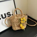 Handcrafted straw bucket bag in natural wood color with yellow floral knit charms - Yellow Fabric Flower Style / Khaki