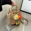Straw bucket bag with drawstring liner and floral charm for beach vacation use - Orange Yellow Dual Flower Style / Khaki