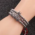 Macro view of adjustable woven bracelets with micro-pave crown and black zircon stones - White Gold Crown Collection