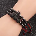 Detail of three black beaded bracelets with crown charm, zircon bar, and red woven cords - Crown and Red Braided Cord Bracelet Combination (Style 3) / Gun Black
