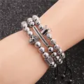 Detail of silver beaded bracelets set featuring zircon skull and crown on black braided cords - Crown and Skull Bracelet Combination (Style 4) / White Gold