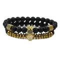 Two-piece beaded bracelet set with black matte stones, golden skull, and crown charms - Matte Stone Bracelet And Gold Surface Bracelet (Gold Set) / Gold