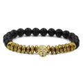 Men's matte black beaded bracelet with gold skull charm and crown accents - Gold Skull Matte Stone Bracelet