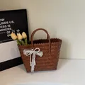 Borsa tote intrecciata testa di moro con fiocco decorativo in pizzo e perle - M