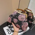 Borsa retrò in jacquard nero con manico in ambra e chiusura in metallo dorato - Rosa