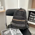 Retro washed denim backpack in dark grey with large main compartment and front pocket - Black