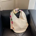 Beige hollow crochet tote bag with colorful floral strap for summer beach travel - Off White Without Lining