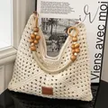 Borsa da spiaggia intrecciata color crema con manici in perline di legno e logo - Bianco Sporco