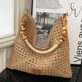 Borsa tote in crochet kaki con manico in perline di legno e logo in pelle marrone - Cachi