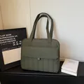 Army green quilted laptop tote bag with large front pocket and long shoulder straps - Green