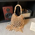 Bohemian beige woven tote bag with fringe details and pearl strap in rustic setting - With Pearl Chain / Khaki