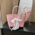 Pink woven hollow basket bag featuring white lace bow detail and matching handle - With Silk Scarf / Pink