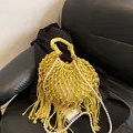 Yellow bohemian woven bag featuring a pearl strap, long tassels, and drawstring liner - With Pearl Chain / Yellow