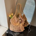 Handcrafted crochet tote bag in beige featuring long fringe tassels and bead accents - Khaki
