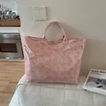 Pink waterproof jelly tote bag featuring laser-cut floral patterns and top handles - Pink
