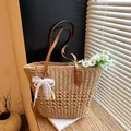 Straw tote bag with brown leather handles and pearl lace bow charm in natural beige - With Pendant / Khaki