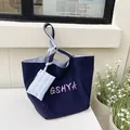 Bolso tote grande azul oscuro con logo GSHYA y asas a rayas para uso diario - Azul Espacial