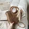 Brown woven straw crossbody bag with white lace bow detail and round top handles - Khaki