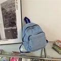 Mini washed denim backpack for women in light blue with dark blue woven straps - Light Blue