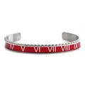 Detail of red enamel open bangle featuring white Roman numerals and gear-style edges - Red Roman Numeral