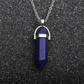 Macro detail of a hexagonal lapis lazuli cone pendant with silver chain necklace - Lapis Lazuli