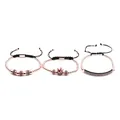 Detail of three rose gold beaded bracelets with blue cubic zirconia crown charms - Rose Gold Blue Zirconia Trio A