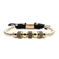 Macro shot of gold beaded bracelet with blue zircon cylinders and adjustable black cord - Gold Blue Zirconia Wheel Beads