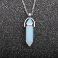 Macro detail of hexagonal opal stone pendant with silver chain on a dark backdrop - Aquamarine