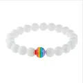 Elastic beaded bracelet featuring white round stones and a colorful rainbow accent bead - Porcelain White Stone