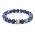 Blue sodalite stone bead bracelet featuring a single rainbow striped accent bead - Blue Vein Stone